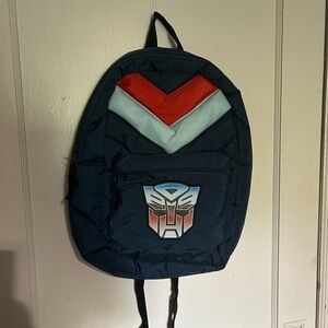 Transformers Autobot Retro Puff Navy Blue Backpack with Red Accents